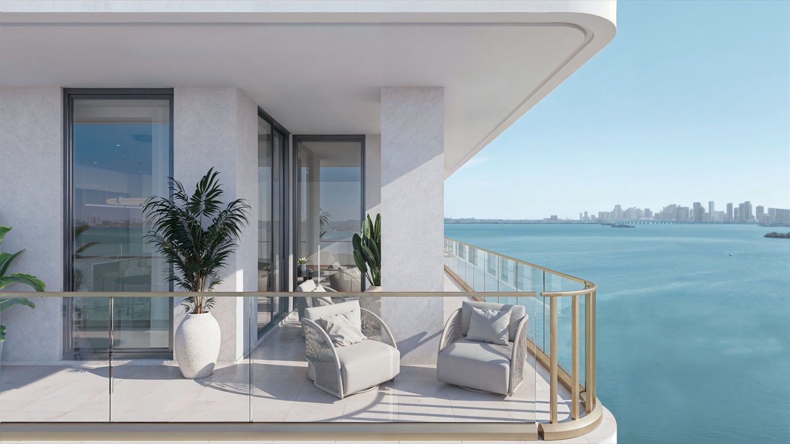Wraparound private terrace at Tula Residences with decorative glass surrounds and panoramic Biscayne Bay views.